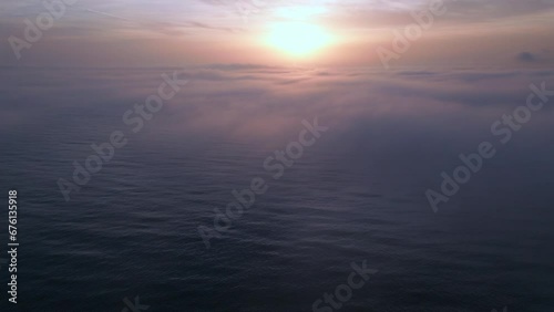 Wallpaper Mural Aerial view of a sunrise sea with a blanket of morning fog and morning sunbeams shining through Torontodigital.ca