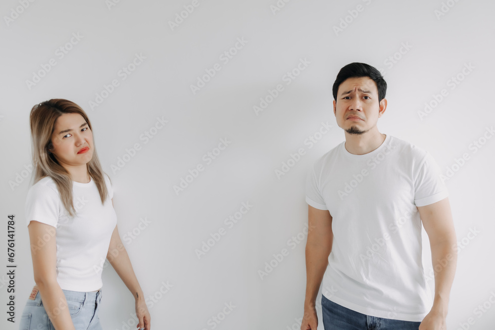 Advertisement copy space of boring face asian lover couple isolated on white. Advertisement copy space of boring face asian lover couple isolated on white.