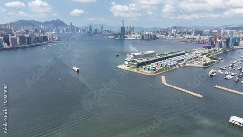 Drone Aerial Skyview of Royal Caribbean Spectrum of the seas Mega Luxury Cruise Ship dock anchor in Commercial construction development project in Kai Tak Sports Park Cruise Terminal in Kwun Tong Kowl photo