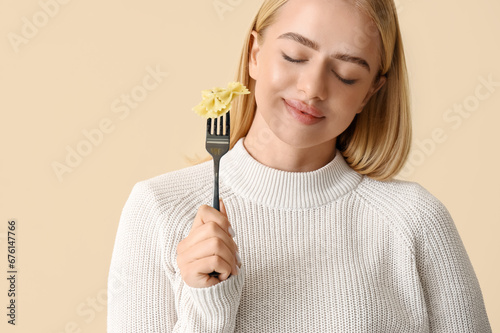 Young woman eating tasty pa...