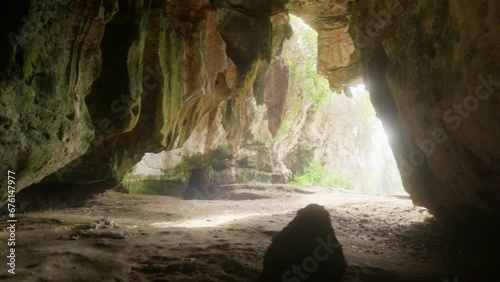 Emerging from the depths Exiting the mysterious cave into the light of discovery