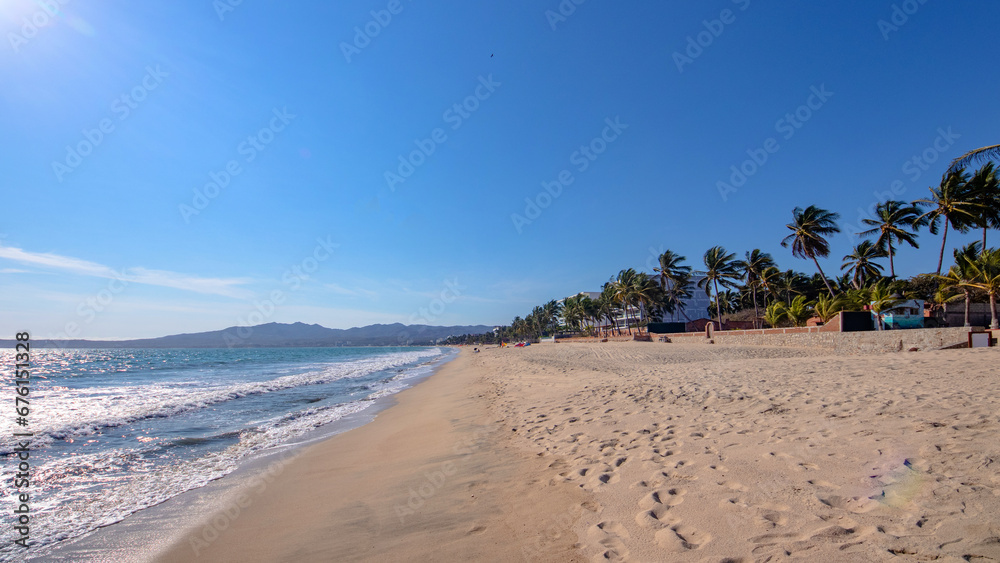 The beautiful sandy beach at Bucerías town in Riviera Nayarit - obrazy, fototapety, plakaty 