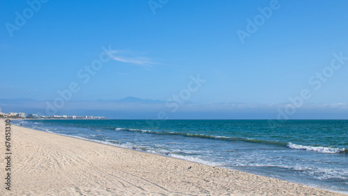 Fototapeta Naklejka Na Ścianę i Meble -  The beautiful sandy beach of Bucerías town in Mexico
