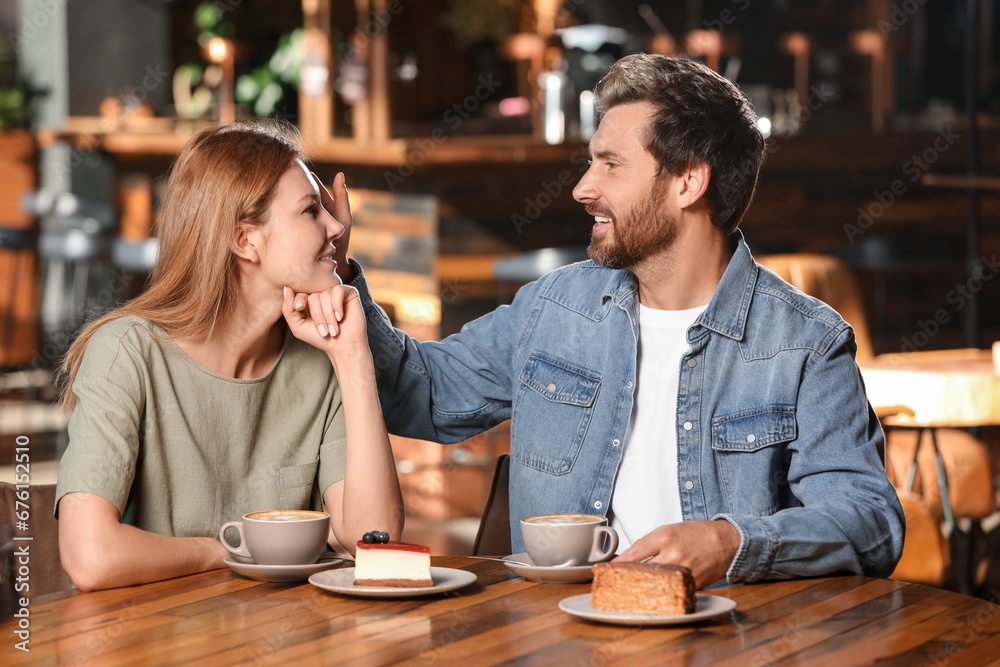 Romantic date. Happy couple spending time together in cafe Romantic date. Happy couple spending time together in cafe