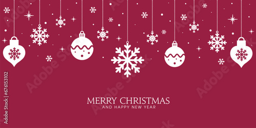 Festive ornaments of white snowflakes and christmas baubles on red background. Red holiday card.