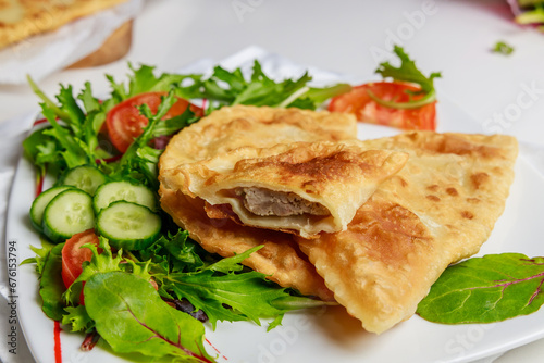 Turkish cuisine is tasty chebureki fried dough with meat.