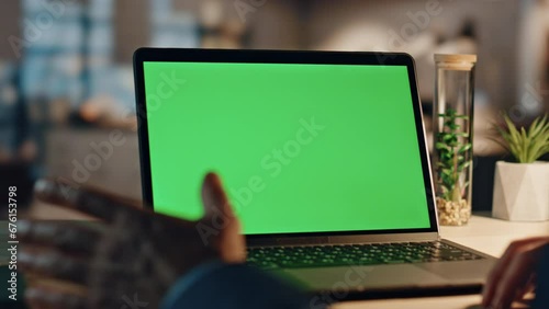 Closeup businessman having videocall at green screen computer in night office photo