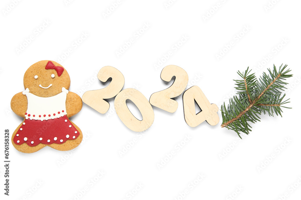 Tasty Christmas cookie in shape of girl and figure 2024 on white background