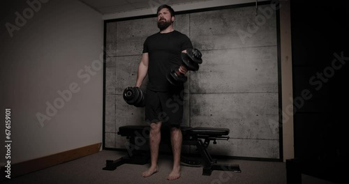 Standing dumbbell supination concentration curls, cinematic lighting, white man dressed in black gym attire. photo