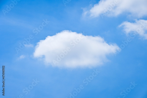 beautiful blue sky and white fluffy group of clouds with sunrise in the morning, natural background
