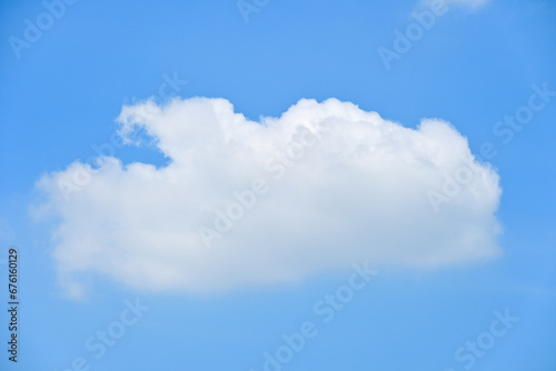 beautiful blue sky and white fluffy single cloud with sunrise in the morning  natural background