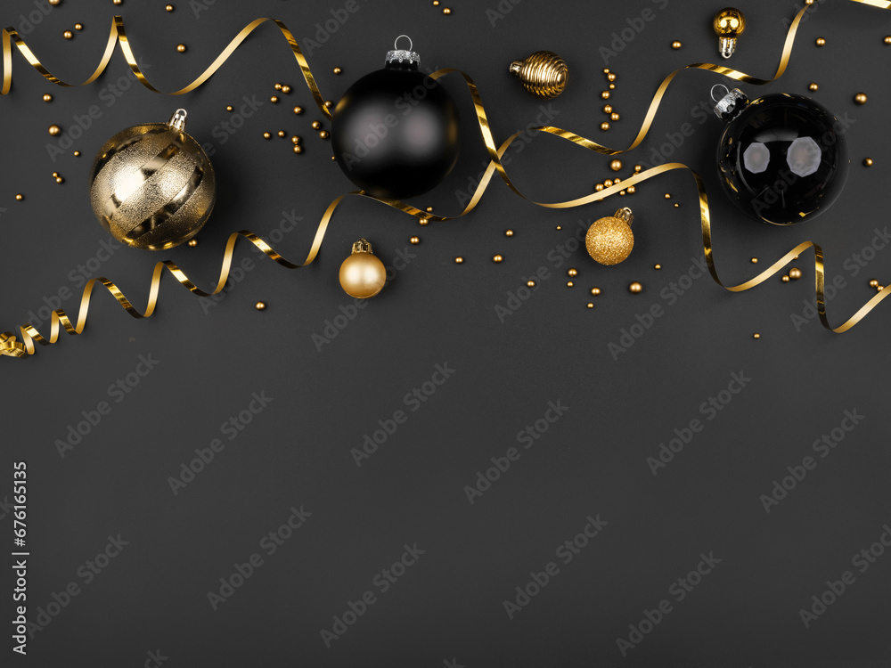 gold and black christmas balls on black background