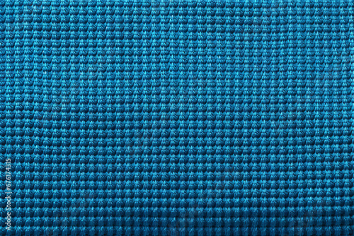 Thin blue woven fabric, closeup of surface material texture