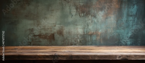 The vintage wood table against the grunge wallpaper on the old wall creates a retro and abstract background with an interesting pattern and texture reminiscent of nature