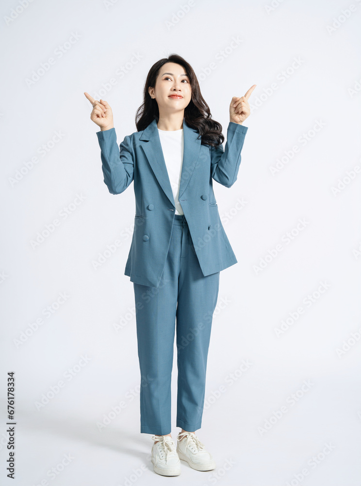 Image of young Asian business woman on background Image of young Asian business woman on background