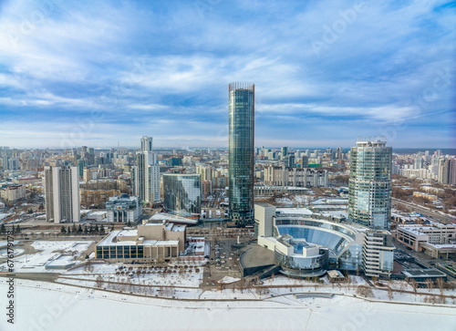Yekaterinburg city with Buildings of Regional Government and Parliament, Dramatic Theatre, Iset Tower, Yeltsin Center, panoramic view at winter sunset.