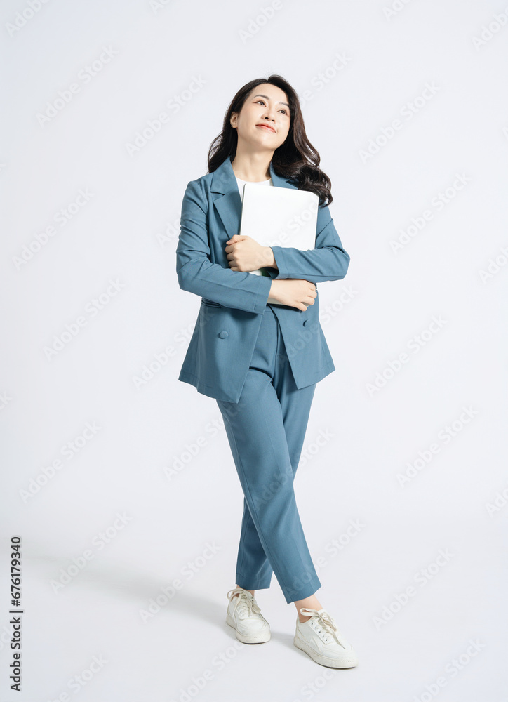 Image of young Asian business woman on background Image of young Asian business woman on background