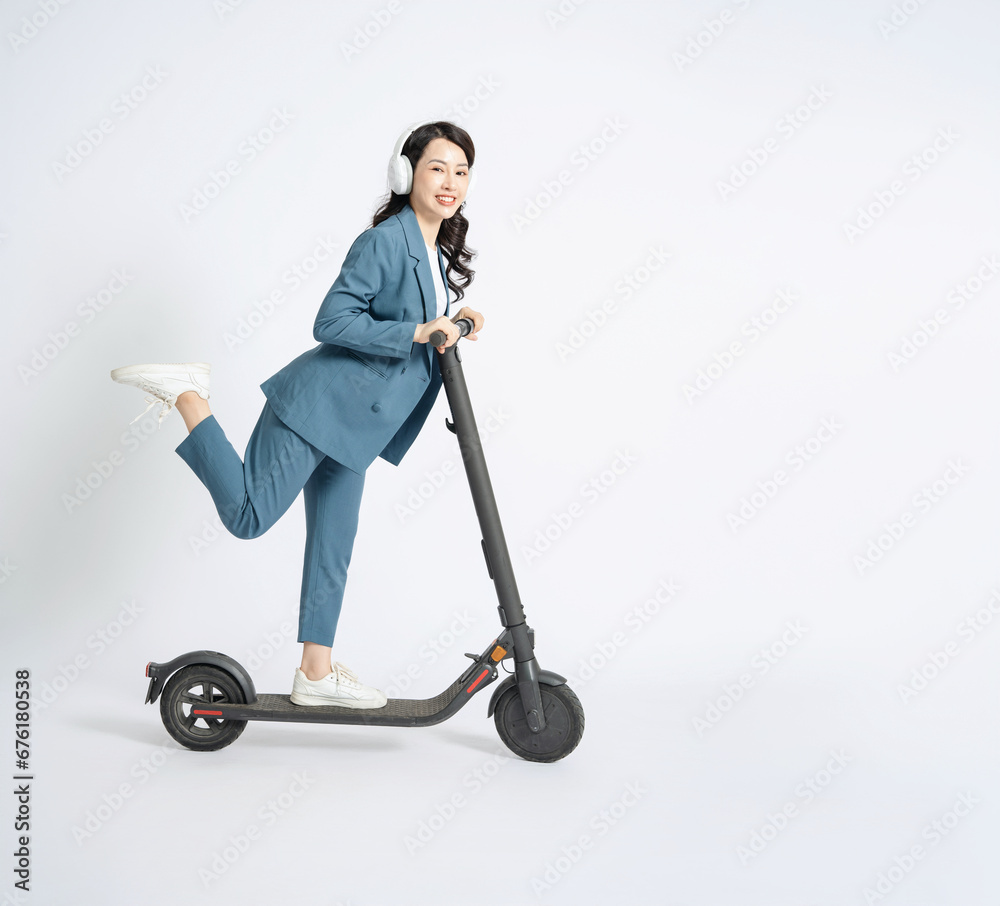 Image of young Asian business woman on background