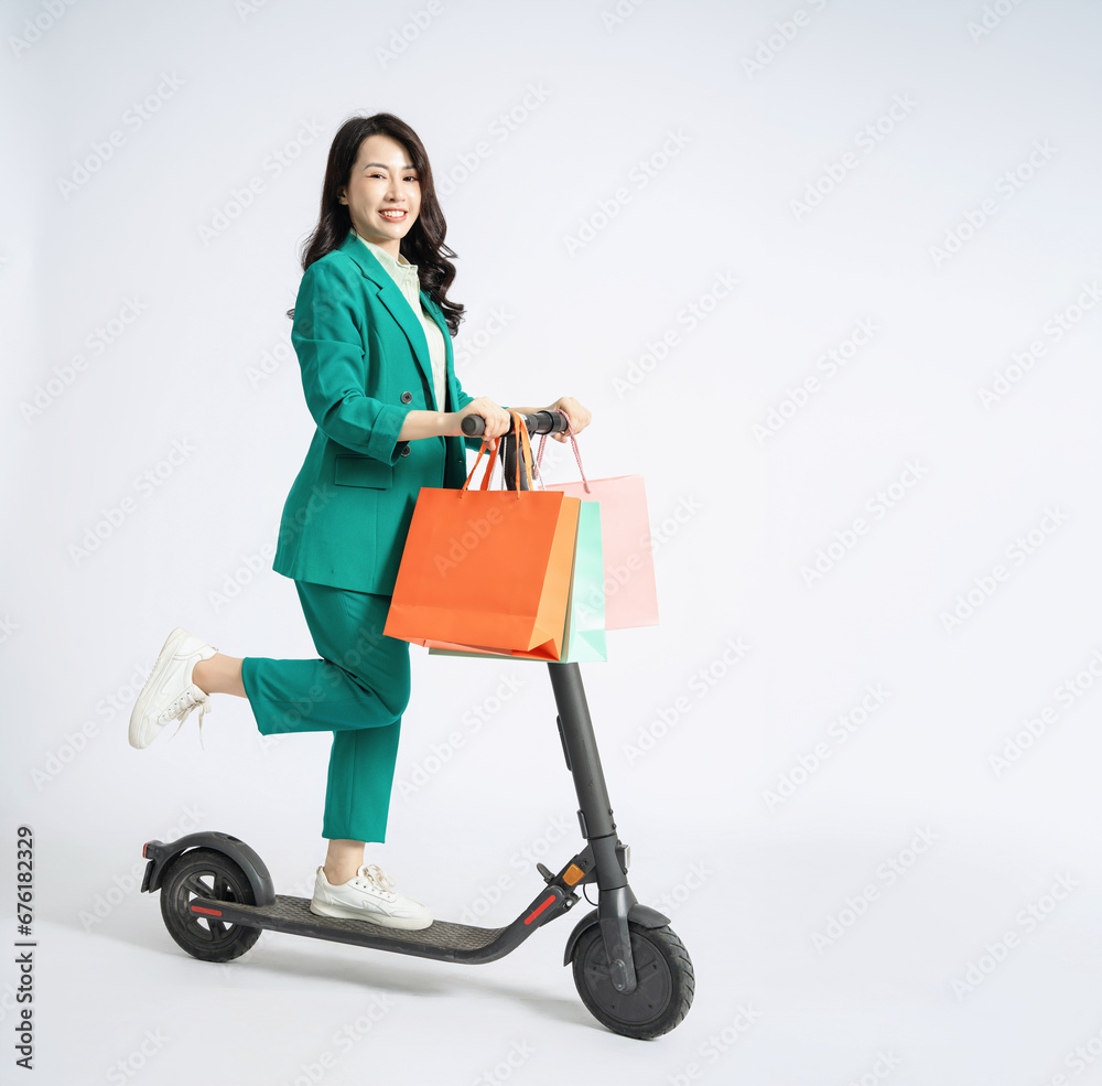 Image of young Asian business woman on background Image of young Asian business woman on background