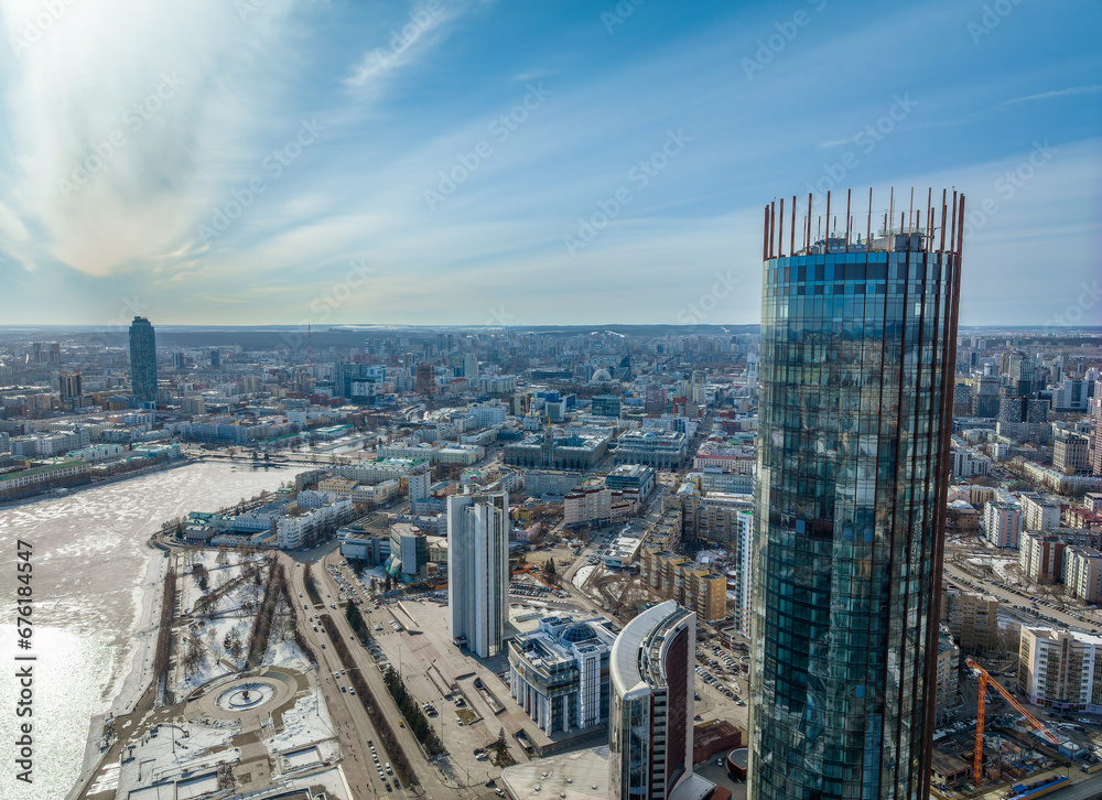 Yekaterinburg skyscraper aerial panoramic view at spring or autumn in clear sunset. Yekaterinburg is the fourth largest city in Russia located on the border of Europe and Asia.