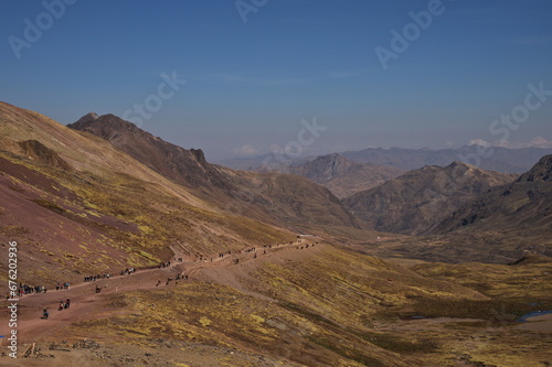 Large group of people hiking towards Rainbow mountain in Peru