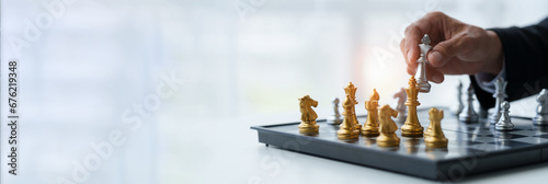 Businessman's hands move chess figures and checkmate opponent during match. Strategy, management, leadership, analysis of development for organizational success. copy space, banner, panorama