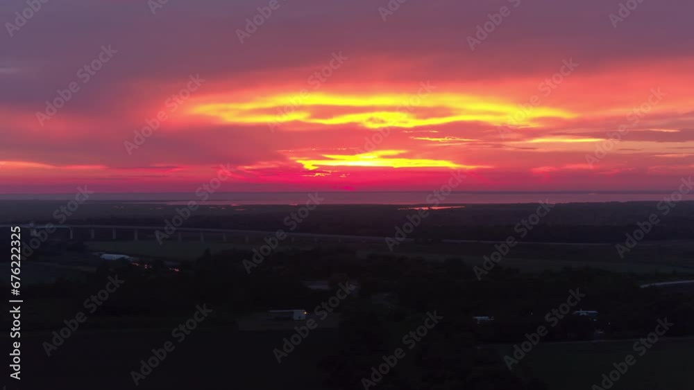 Aerial Panning Scenic Shot Of Meadow Landscape Under Dramatic Cloudy Sky During Sunset - Bayou, Louisiana Aerial Panning Scenic Shot Of Meadow Landscape Under Dramatic Cloudy Sky During Sunset - Bayou, Louisiana