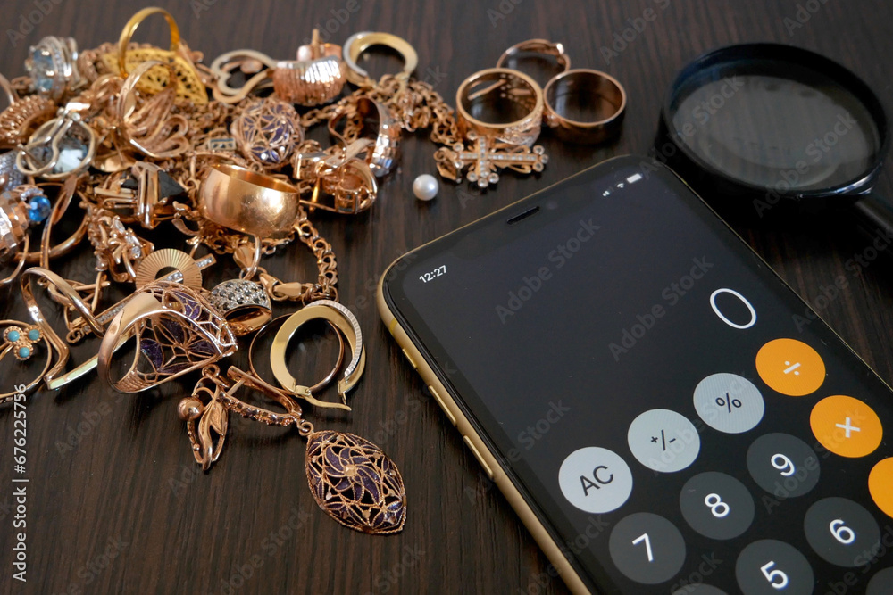 custom made wallpaper toronto digitalPawnshop concept, calculator, a lot of gold jewelry and a magnifying glass on a dark wooden table, top view,