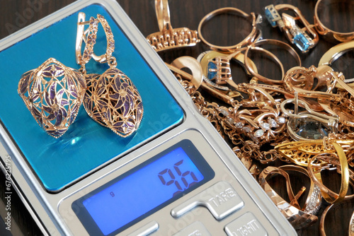 Wallpaper Mural Pawnshop concept, composition with jewelry scales and a lot of gold jewelry, top view Torontodigital.ca