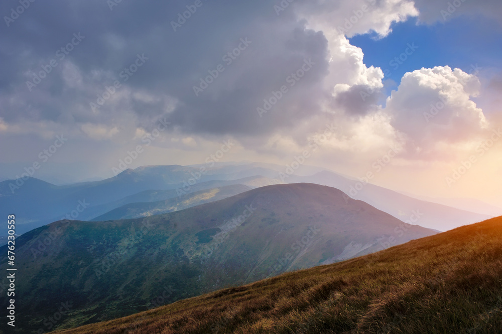 Wonderful mountain landscape with storm clouds. Sunset. Dramatic scene and picturesque picture. Carpathian, Ukraine, Europe.