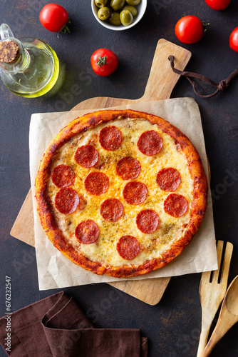 Pizza with pepperoni and cheese. Fast food. Italian cuisine. American food.