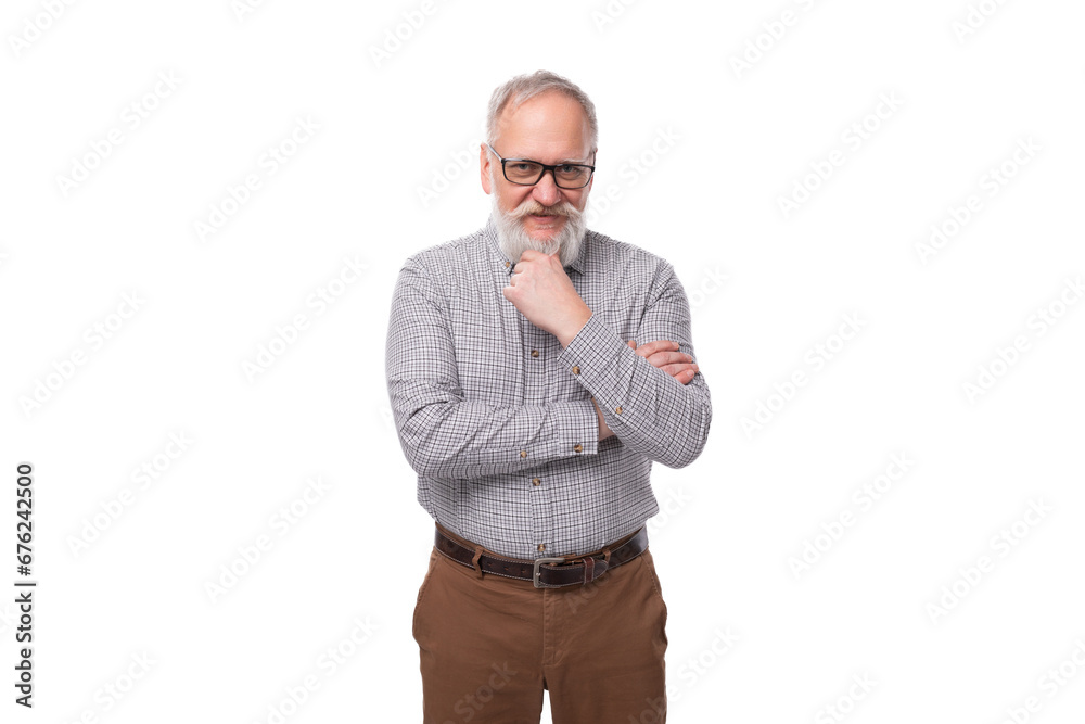 handsome gray-haired mature businessman with a beard and mustache in a shirt and trousers handsome gray-haired mature businessman with a beard and mustache in a shirt and trousers