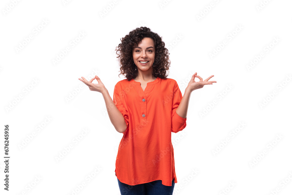 portrait of a bright young caucasian brunette woman with curly hair dressed in an orange shirt portrait of a bright young caucasian brunette woman with curly hair dressed in an orange shirt
