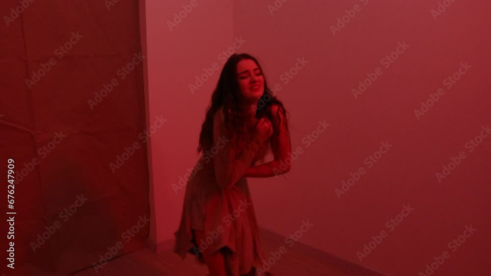 Captivating Beauty in Red Light Energetic Dancer's Sensual Solo Performance