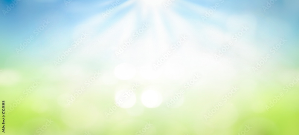 world environment day concept, Beautiful spring blur green nature with bokeh sun light flare and blue sky white cloud abstract background.