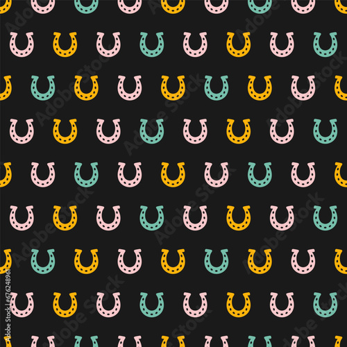 Seamless pattern with colorful horseshoe and black background