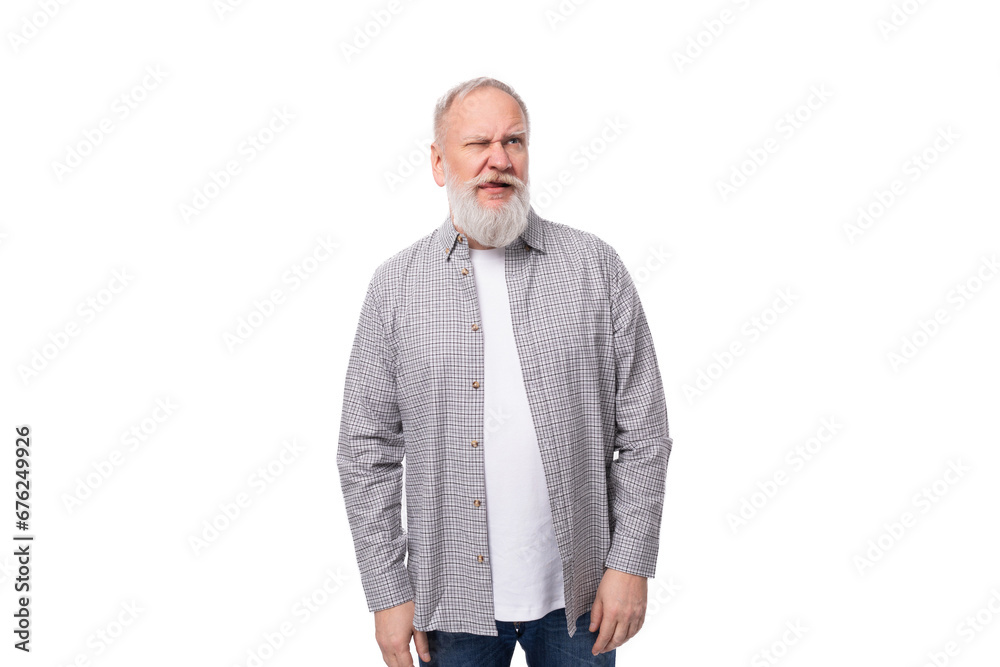 handsome gray-haired elderly man with a beard in a checkered shirt on a white background with copy space handsome gray-haired elderly man with a beard in a checkered shirt on a white background with copy space