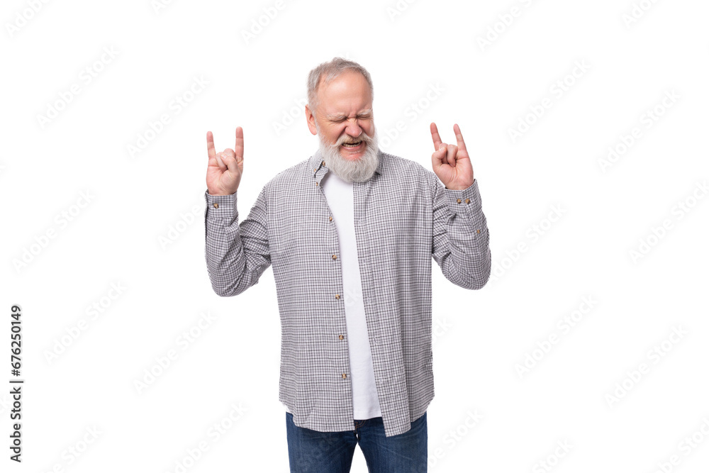 handsome gray-haired elderly man in a shirt shows with his hands that he is cool on a white background with copy space handsome gray-haired elderly man in a shirt shows with his hands that he is cool on a white background with copy space