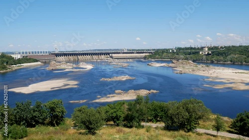 Panoramic view of the tailwater of the Dniproges Hydroelectric Power Station dam with shallows and rocks photo