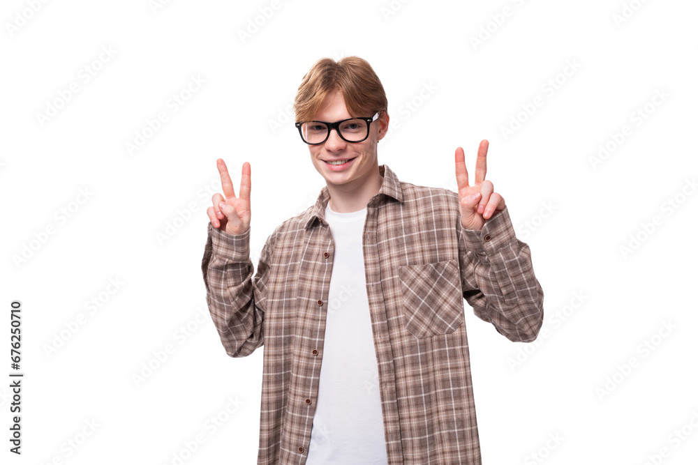 young friendly man with red hair shows welcome gesture young friendly man with red hair shows welcome gesture