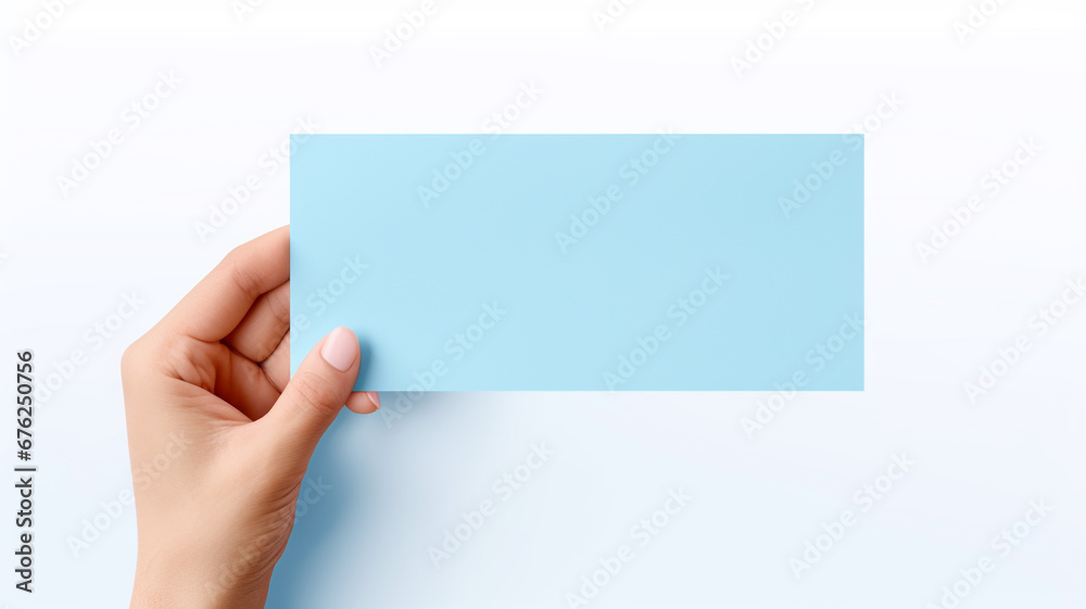 hand holding blue paper isolated on white background. concept cyber monday. hand holding blue paper isolated on white background. concept cyber monday.
