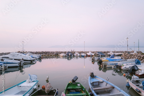 kleiner Hafen am Gardasee bei Dämmerung photo