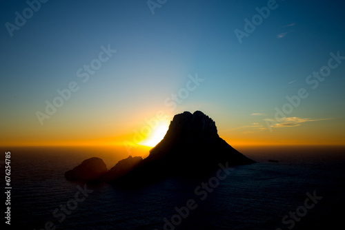 Beautiful sunset at Cala d'hort with Es Vedra island beach in Ibiza, Spain.