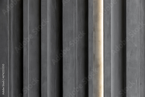 Gray concrete wall with glowing light line, background texture