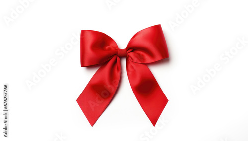 Lustrous red satin bow centered on a white backdrop
