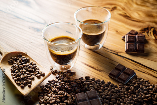 Fototapeta espresso in the glass and raw beans