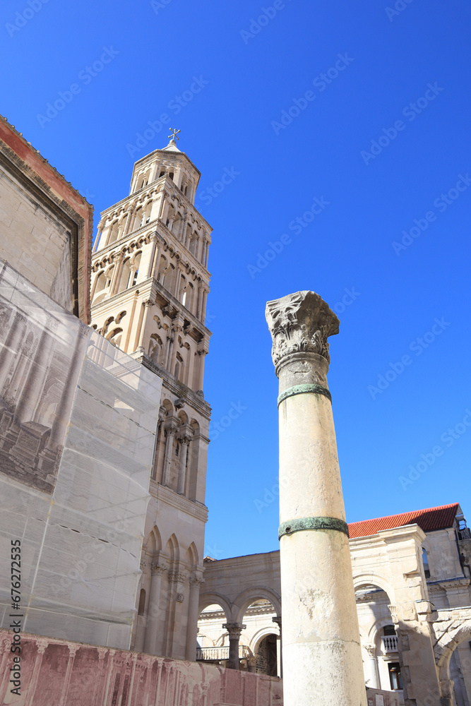 Belfry of Cathedral of St. Dujma (Assumption of the Blessed Virgin Mary) and vintage column in Split, Croatia