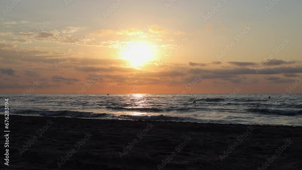 Calm Mediterranean Sea and Sandy Beach at Sunrise, Benicàssim Seascape in Spain Calm Mediterranean Sea and Sandy Beach at Sunrise, Benicàssim Seascape in Spain