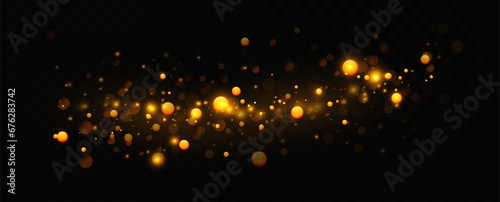 Golden sequins glow with many lights. Glittering dust. Luxurious background of golden particles.