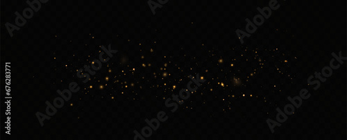 Golden sequins glow with many lights. Glittering dust. Luxurious background of golden particles.